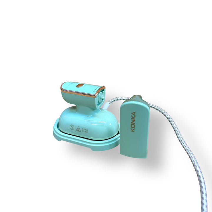 Mint green Konka Travelling Steam Iron with gold trim, compact steam iron for travel