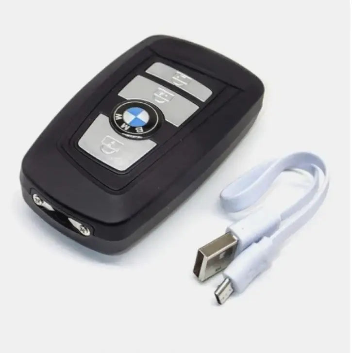 Black BMW key fob with silver buttons and stun tool USB charging cable for defence 3-in-1