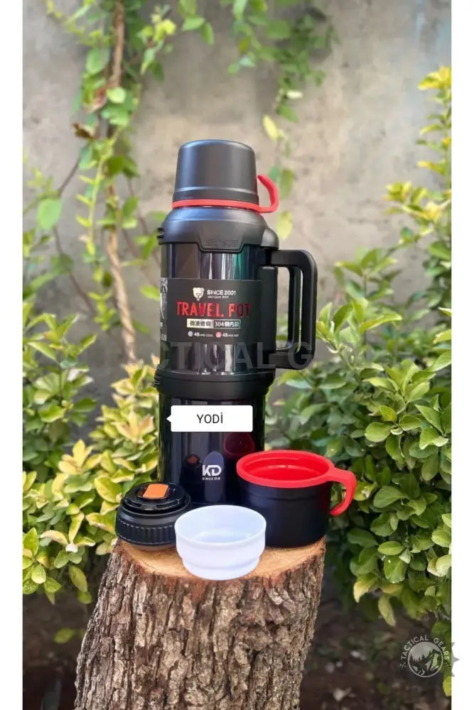 Black travel thermos with red handle and two cups, ideal outdoor gear and water bottle