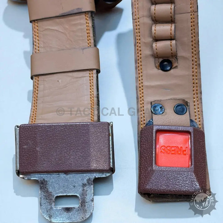 Leather belly holster with tan leather belts and a red press button for 9mm firearms