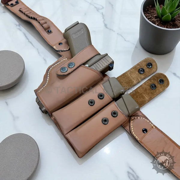 Light brown leather belly holster with matching magazine pouches for 9mm firearms