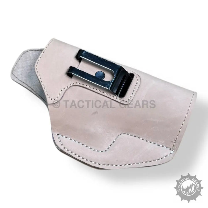 Light-colored leather gun holster for 9MM with metal belt clip and easy-to-use stitching