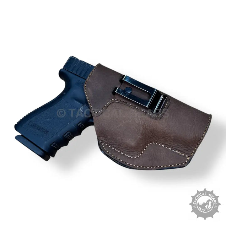 Easy-to-wear dark brown leather pistol holster with black metal belt clip for concealed carry