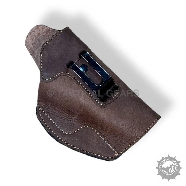 Brown leather gun holster with metal belt clip for 9MM easy access and secure carry