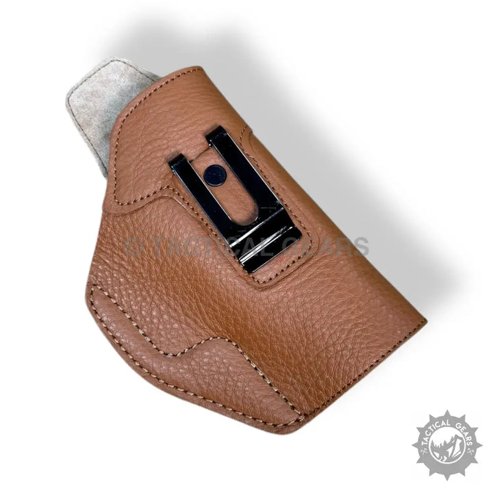 Brown leather gun holster with black metal belt clip for easy 9MM concealed carry