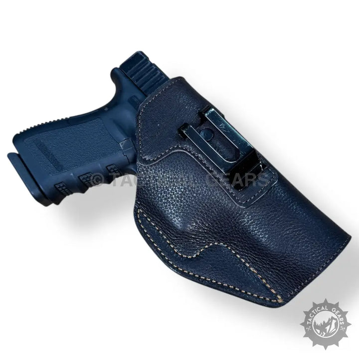 Easy-to-use dark blue textured leather holster for 9MM handguns with metal belt clip