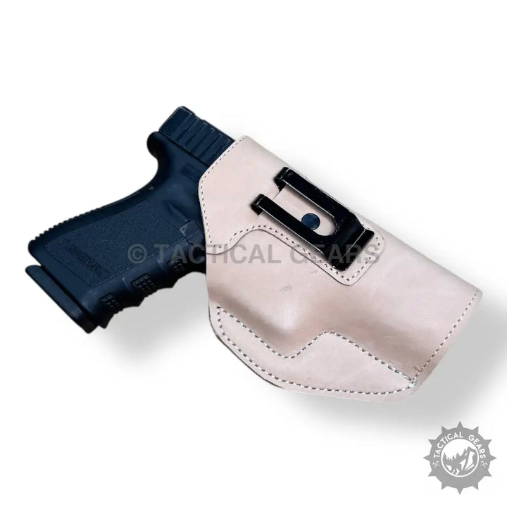 Light-colored leather gun holster for 9MM with easy-to-use black metal clip
