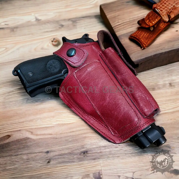 Red leather pistol holster with magazine pouch and snap closure for firearm enthusiasts