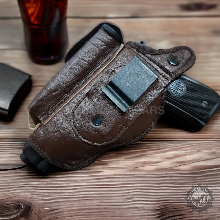 Brown leather handgun holster with mag pouch and metal clip for right or left hand use