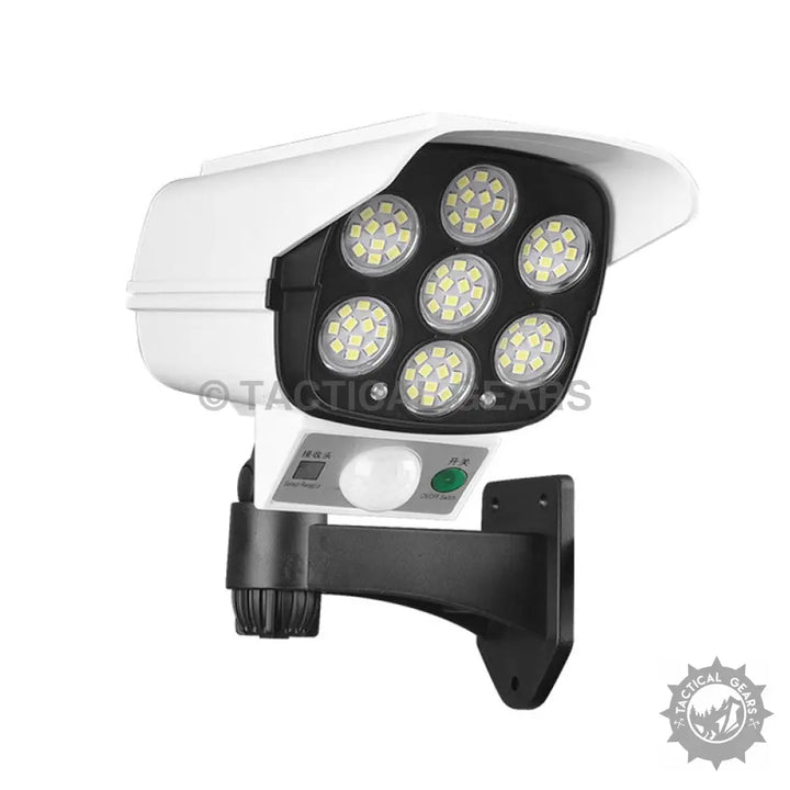 White solar-powered LED fake camera with motion sensor and solar panel for outdoor security