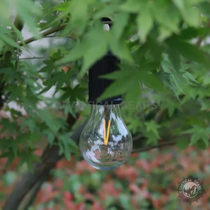 Clear tear-drop LED portable hanging camping tent bulb with yellow filament for outdoor use