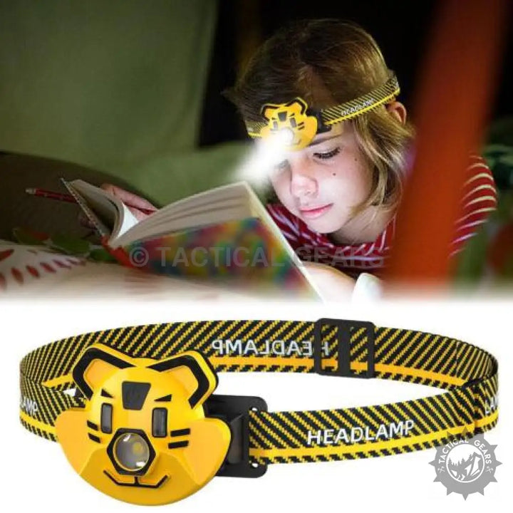 Yellow tiger-shaped LED headlamp with adjustable black and yellow striped strap for outdoor use