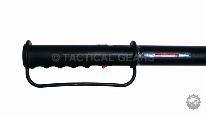 Black handled long multi-purpose self-defense device with red button for tactical use