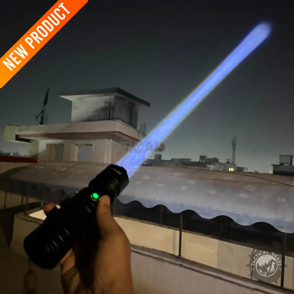 Black handheld P90 Tactical Flashlight emitting a blue beam, LOT Imported P90 flashlight