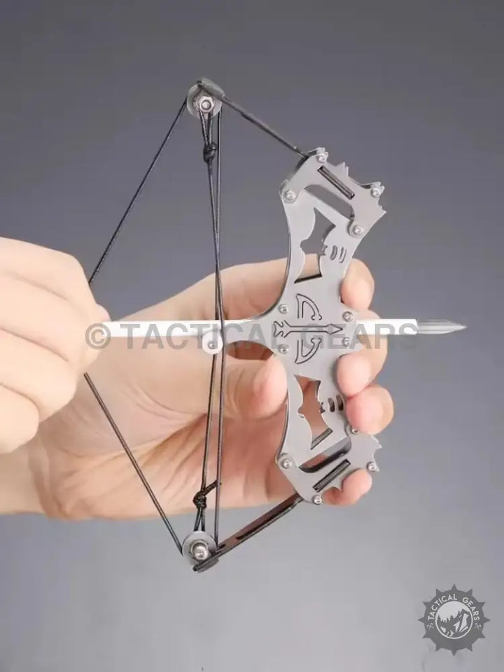 Mini compound bow with arrow loaded held by hands, perfect for beginners and kids