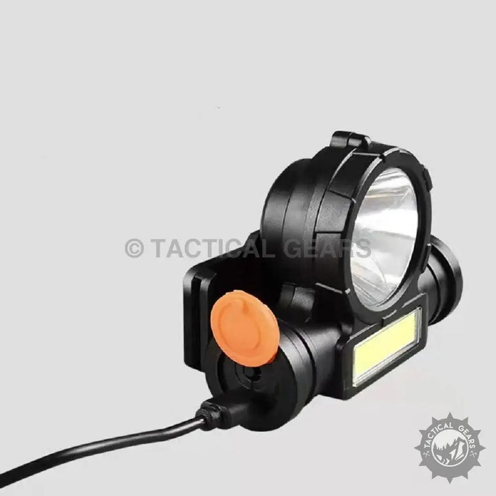 Black rechargeable mini headlight with large main light, side light, orange power button