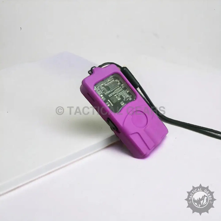 Mini high voltage Taser with exposed circuit board and black lanyard for self-defense