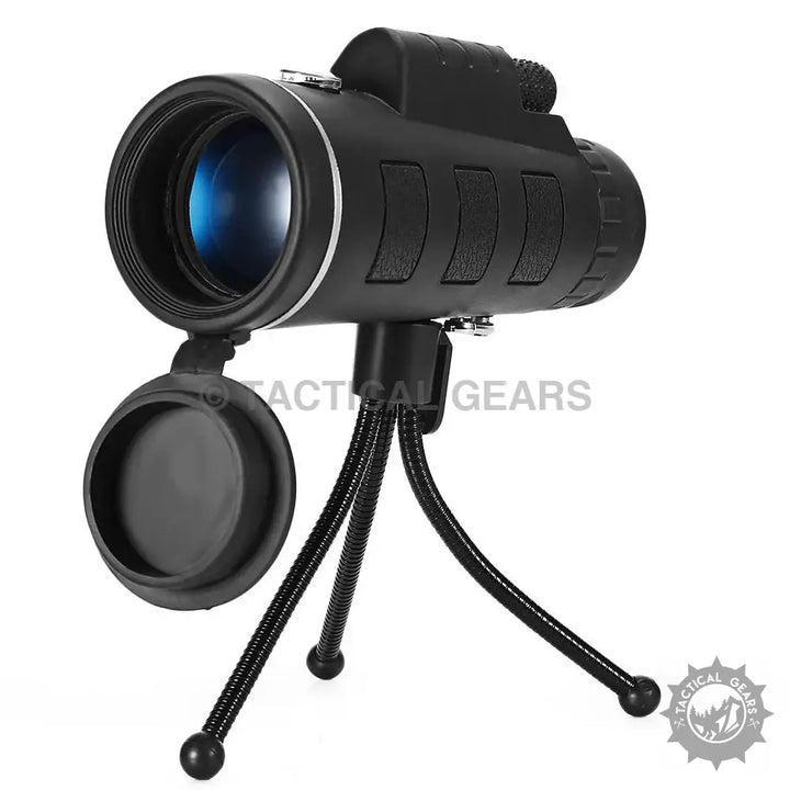 Black mobile monocular telescope with tripod and lens cap for easy outdoor viewing