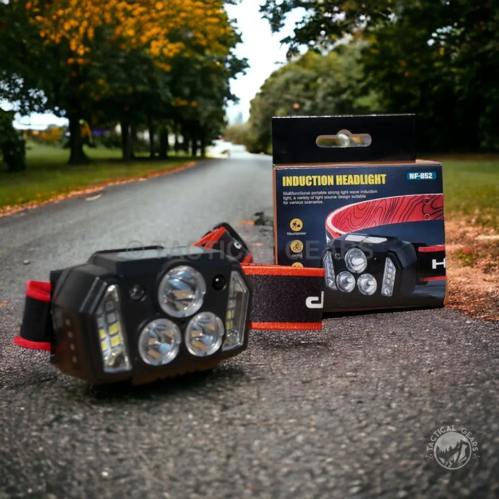 Outdoor black and orange induction headlamp with multiple LED lights for versatile use