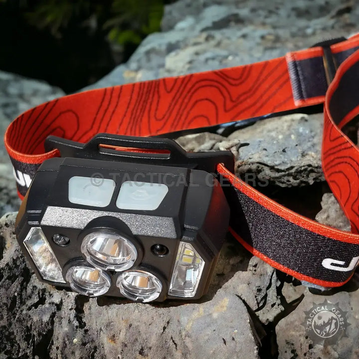 Outdoor Multi Purpose Induction Headlight with LED lights and orange black patterned strap