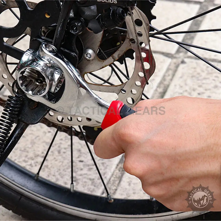 Chrome multi-socket wrench with red and black handle for bike maintenance, universal socket wrench