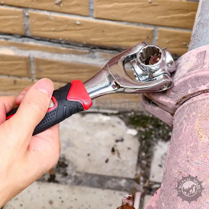 Hand holding an 8 in 1 Universal Socket Wrench with multi-size nuts and red black grip