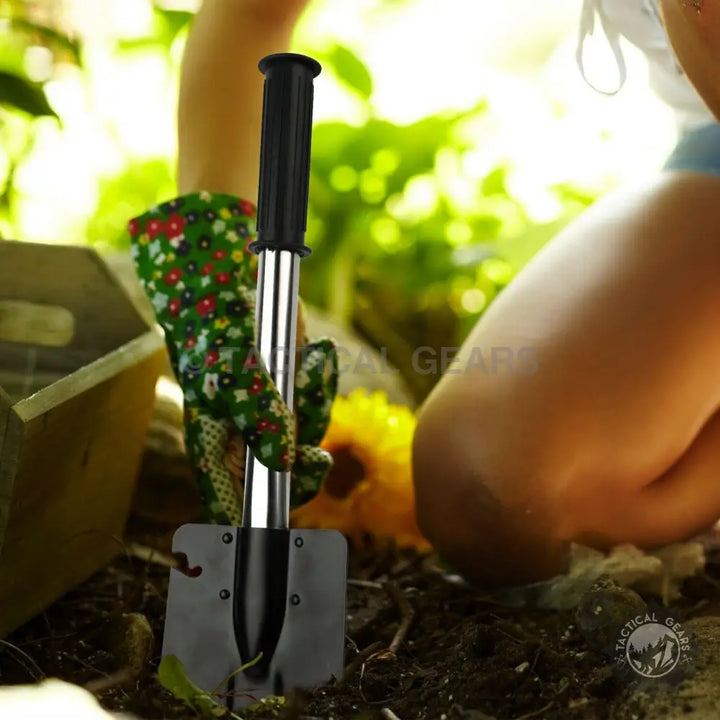 Black and silver folding camping shovel with serrated edge and bottle opener, 4cm x 4cm