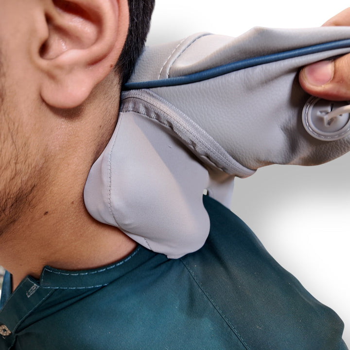 Person using Gray Neck Massager HJ-188 with Blue Trim for Relaxation
