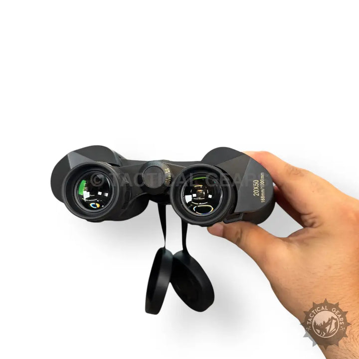 Black 20x50 sports binoculars with green-coated lenses and attached lens caps