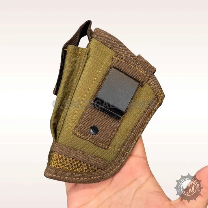 Tan fabric Glock holster with black metal belt clip and brown webbing trim for design Glock holster