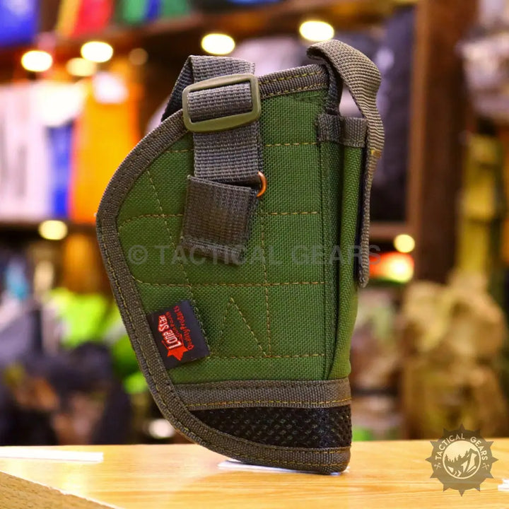 Olive green tactical holster with adjustable straps and textured base for universal holster use