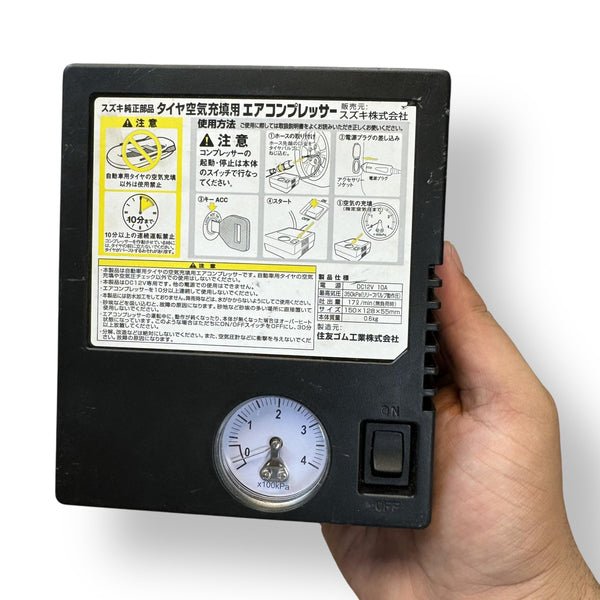 Black portable tire inflator with pressure gauge and on/off switch for original tire inflator use