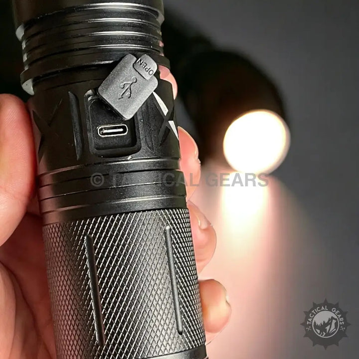Black metal P90 Tactical Flash Light with USB-C port and textured grip for durable illumination