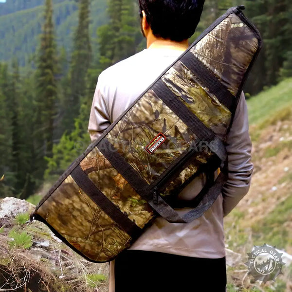 Camo rifle case with shoulder strap and carrying handle featuring zipper pouch for storage