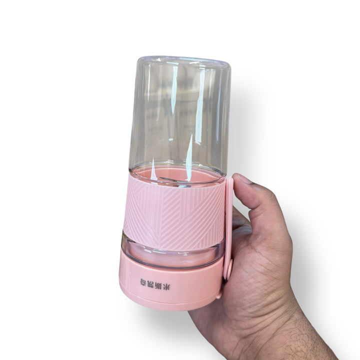 Pink portable blender with clear top and carrying strap from Blender Lot Imported
