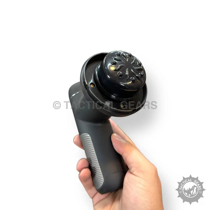 Handheld black and gray deep rolling massager with textured multi-pronged head