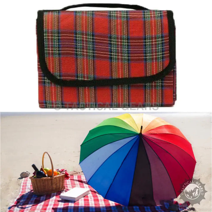 Red plaid picnic blanket with black trim and carrying handle, perfect for outdoor picnics