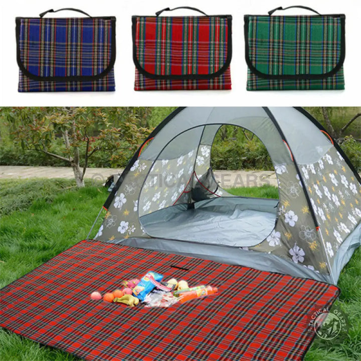 Foldable blue, red, and green picnic blanket used with tent and snacks on portable picnic mat