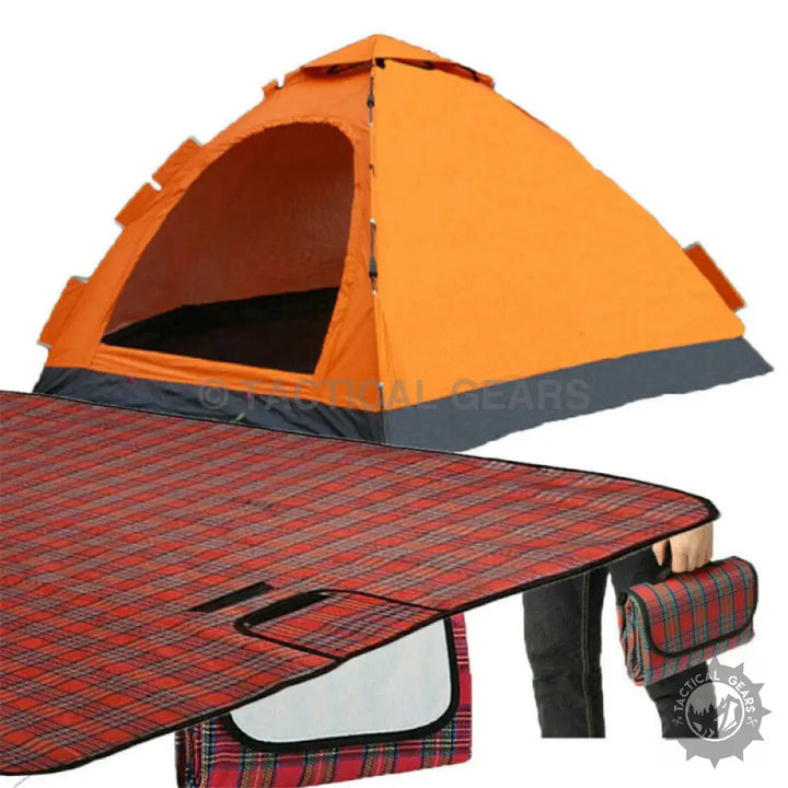 Orange dome tent and red plaid picnic blanket on a portable waterproof picnic mat