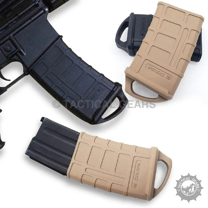 Multiple AR-15 style magazines with tan and black polymer base plates and PMAG-Magazine Rubber Cover