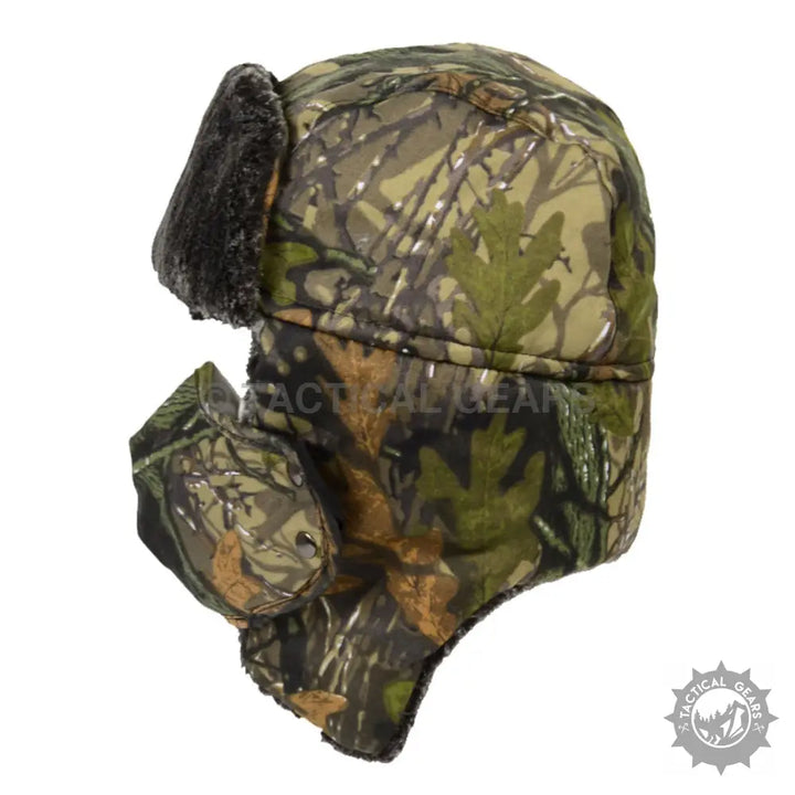 Camo trapper ski hat with black faux fur ear flaps and chin strap for staying warm