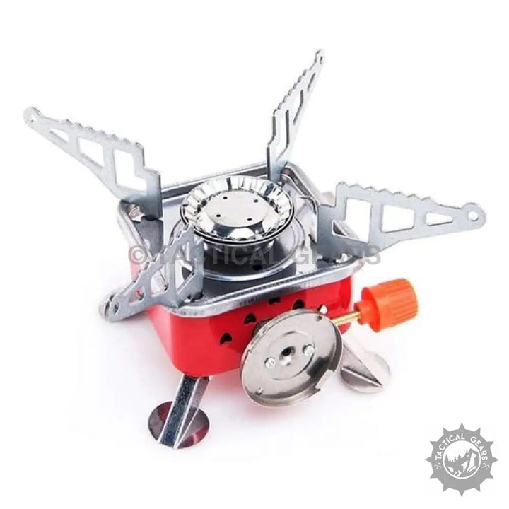 Red and silver portable butane stove with foldable supports and orange igniter for camping
