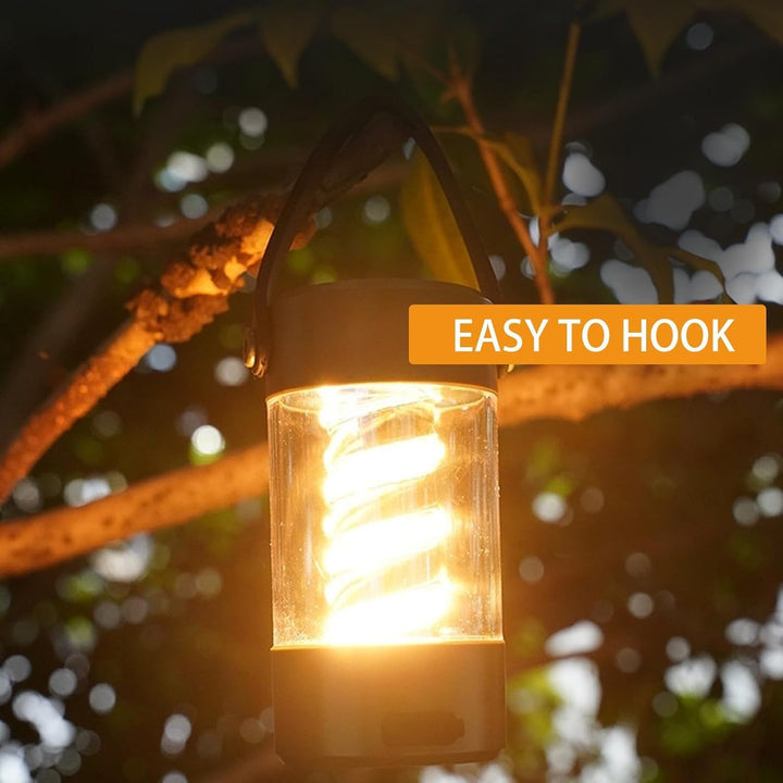 Portable camping light with built-in Bluetooth speaker and hanging lantern with spiral filament