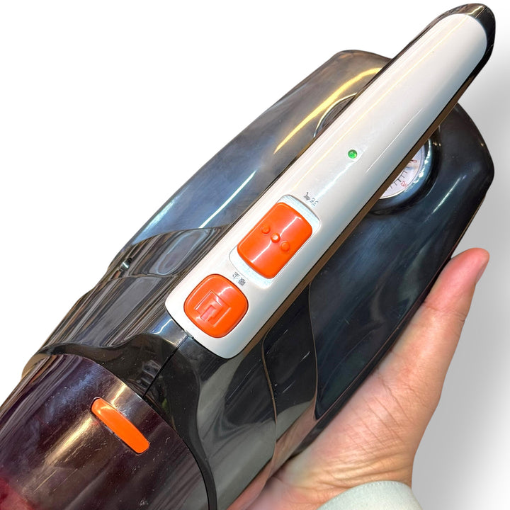 Handheld car vacuum cleaner with orange buttons from Portable Car Vacuum Cleaner and Air Compressor