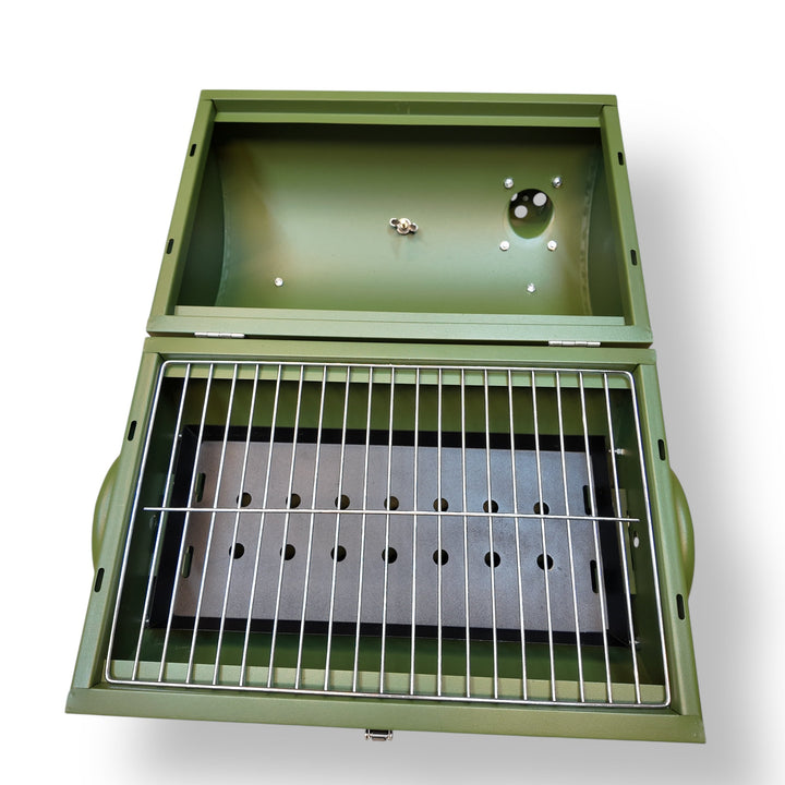 Open dark green portable charcoal BBQ grill with metal grate and perforated base