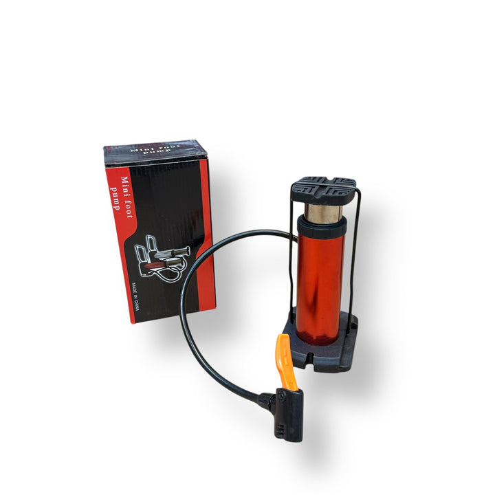 Red and black portable imported mini foot pump with flexible hose and nozzle for inflating