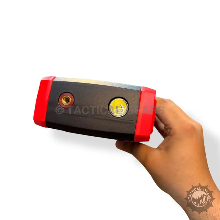 Portable jump starter with integrated flashlight and tire inflator for emergency car aid