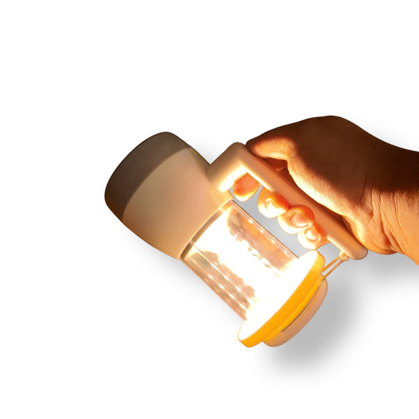 Hand holding a Portable LED Flashlight Lantern emitting a warm lamp with white LED light