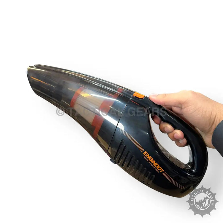 Portable rechargeable car vacuum cleaner with black body, orange accents, and clear dust chamber