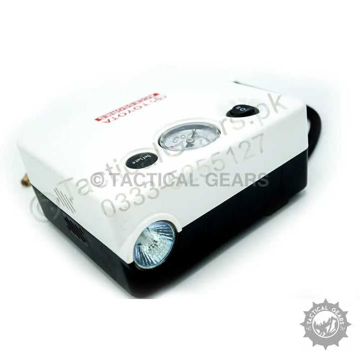 White and black Toyota Air Compressor with analog gauge and built-in light for portable air inflation
